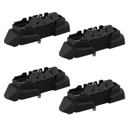 Four black plastic components from Thule Fit kit on a white background